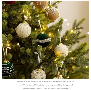 Detail view of elegant flocked velvet Christmas ornaments with pearl beads on a tree