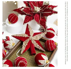 Detailed view of wine red flocked Christmas tree ornaments with star topper and balls