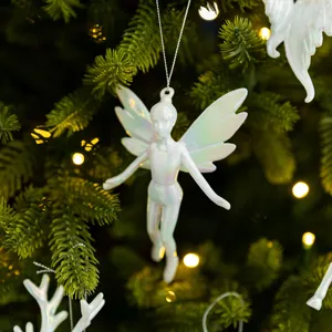Iridescent white fairy angel Christmas tree ornament with wings hanging on pine
