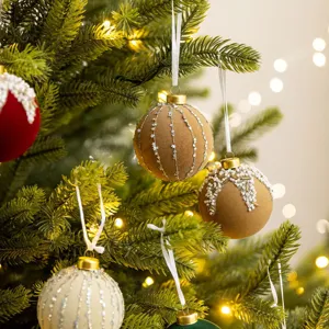 Elegant flocked Christmas tree baubles with pearls and silver stars for festive decor