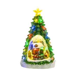 Festive illuminated Christmas tree with LED snow house and rotating train music box