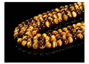 Détail macro professionnel de perles en œil de tigre jaune naturel 7A pour bijoux fins