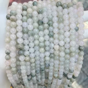 Detailed macro view of natural Tianshan ice jade round beads for DIY jewelry making