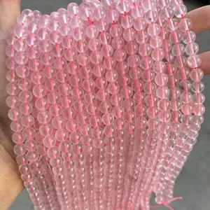 Detailed view of 8mm natural ice pink rose quartz round beads for DIY jewelry making crafts