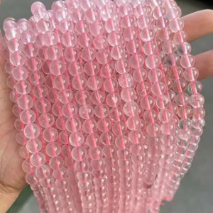 Detailed close-up showing texture of natural 8mm ice pink rose quartz round beads
