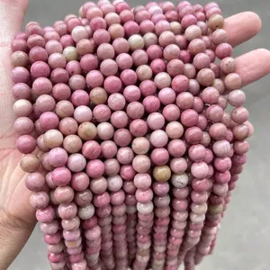 Detail of natural pink 5A Rhodonite round stone beads for DIY jewelry accessories