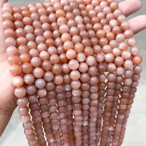 Nahaufnahme von hochwertigen 7A orangefarbenen Sonnenstein-Rundperlen für DIY-Schmuck
