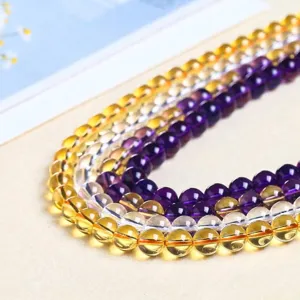 Strands of translucent purple, yellow, and clear crystal round beads for DIY jewelry