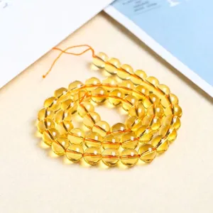 Yellow piezoelectric crystal round loose beads for DIY jewelry making and bracelets.
