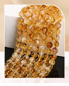 Close-up detail of natural yellow citrine beads for DIY jewelry making accessories.