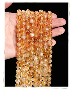 Macro view of natural yellow citrine crystal bead strands for DIY jewelry making