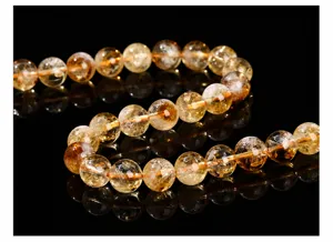 Macro view of high quality faceted yellow phantom quartz beads for DIY jewelry making projects