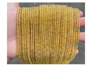 Close-up of 3mm natural golden rutilated quartz beads showing clear crystal texture.