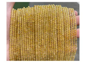 Detailed close-up of 3mm natural golden rutilated quartz round loose beads for DIY