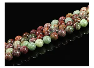 Detailed macro view of polished natural green color pattern stone beads for jewelry