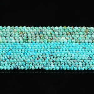 Natürliche Türkis-Rundperlen für die DIY-Armband-Schmuckherstellung auf schwarzem Grund