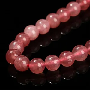 Close-up of 8mm pink strawberry quartz chalcedony loose round beads for jewelry DIY
