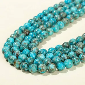 Strand of vibrant blue turquoise round beads with brown matrix for DIY jewelry making