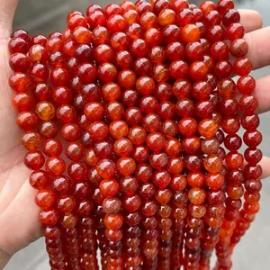 Close-up view of red dragon vein agate loose beads with detailed crackle texture