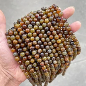 Detailed macro view of tea-colored dragon vein agate round beads for DIY jewelry making