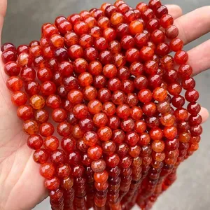 Detailed macro view of red dragon vein agate round beads for DIY jewelry