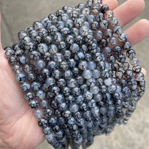 Detailed view of high quality black dragon vein agate beads for jewelry making