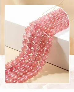 Detailed macro view of 3A natural strawberry quartz round beads for DIY jewelry making