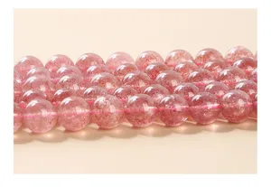 Macro detail of pink natural strawberry quartz round beads for DIY jewelry making