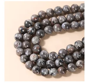 Macro detail view of natural flame stone round beads for DIY jewelry bracelet making