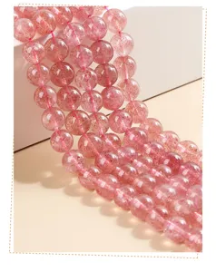 Close-up of 3A natural strawberry quartz loose beads showing fine internal inclusions