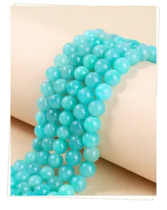 Macro view of polished natural light blue ice Amazonite round beads for DIY jewelry making