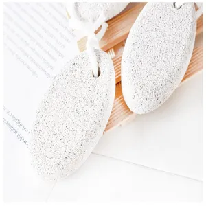 Detail view of natural volcanic pumice foot scrubber stone with hanging cord for dead skin.