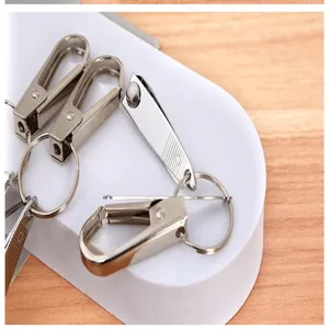 Close-up view of stainless steel nail clipper keychain set, practical portable multi-tool accessory.