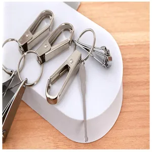 Close-up detail of multi-functional metal nail clipper keychain set with portable tools.