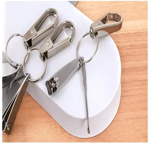 Stainless steel nail clipper set detail, portable mini keychain tool for daily grooming.