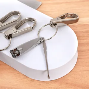 Portable metal nail clipper keychain set with ear pick and carabiner for daily use and gifts.
