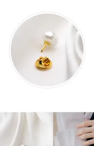 Pearl anti-glare brooch detail, gold metal pin and pearl button for clothing and shirt fixing.
