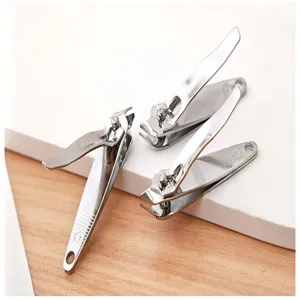 Stainless steel nail clipper detail view, sharp angled blade and hanging hole design.