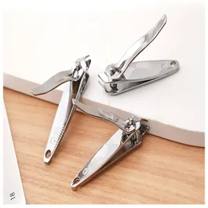 Detailed close-up shot of stainless steel nail clippers, showcasing sharp blades and metal finish.