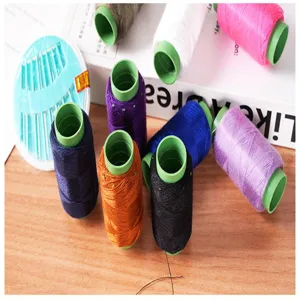Colorful sewing thread spools set with needles, ideal for home tailoring and clothing repair.