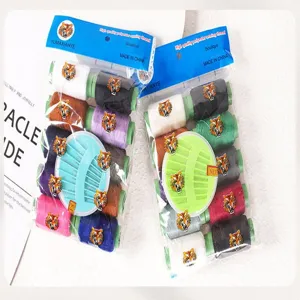 Multicolor polyester sewing thread set with needles, household hand craft colored spools detail.