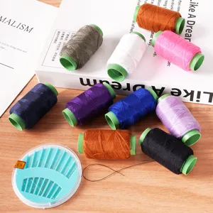 Household sewing thread set with colorful spools and needle box for DIY clothing repair and crafts.