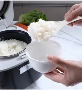 Detail view of the melamine rice paddle, non-stick rice spoon for kitchen cooker.
