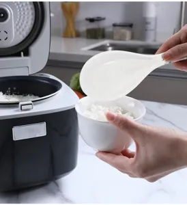 Melamine rice paddle non-stick spoon high temperature resistant kitchen tool for home use.