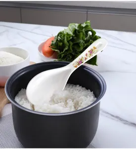 Melamine rice spoon with floral handle, non-stick kitchen rice cooker serving scoop tool.