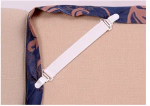 Bedsheet fastener elastic strap detail showing white clips and stretchable band for secure fit.