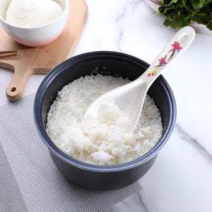 Melamine rice spoon with floral handle, heat resistant non-stick serving scoop for kitchen use.