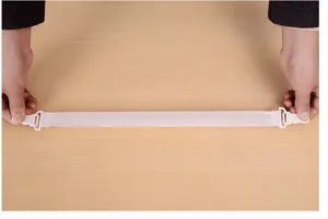 Detail view of elastic bed sheet fastener strap with durable plastic clips for secure sheet holding.