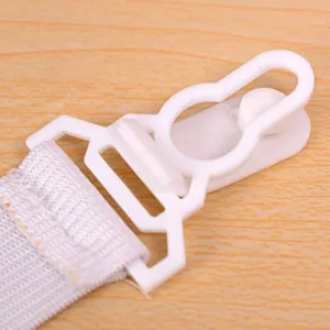 Durable white plastic bed sheet clip with elastic strap for secure non-slip mattress fastening.