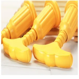 Detail shot of bright yellow plastic wine bottle openers showcasing the handle design and texture.
